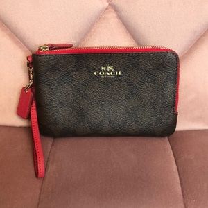 Red and brown Coach wristlet